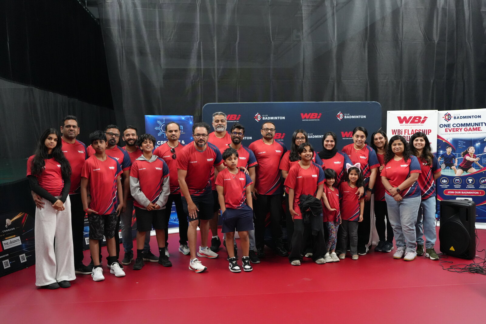 Team WBi together in their red and navy shirts at the end of the tournament