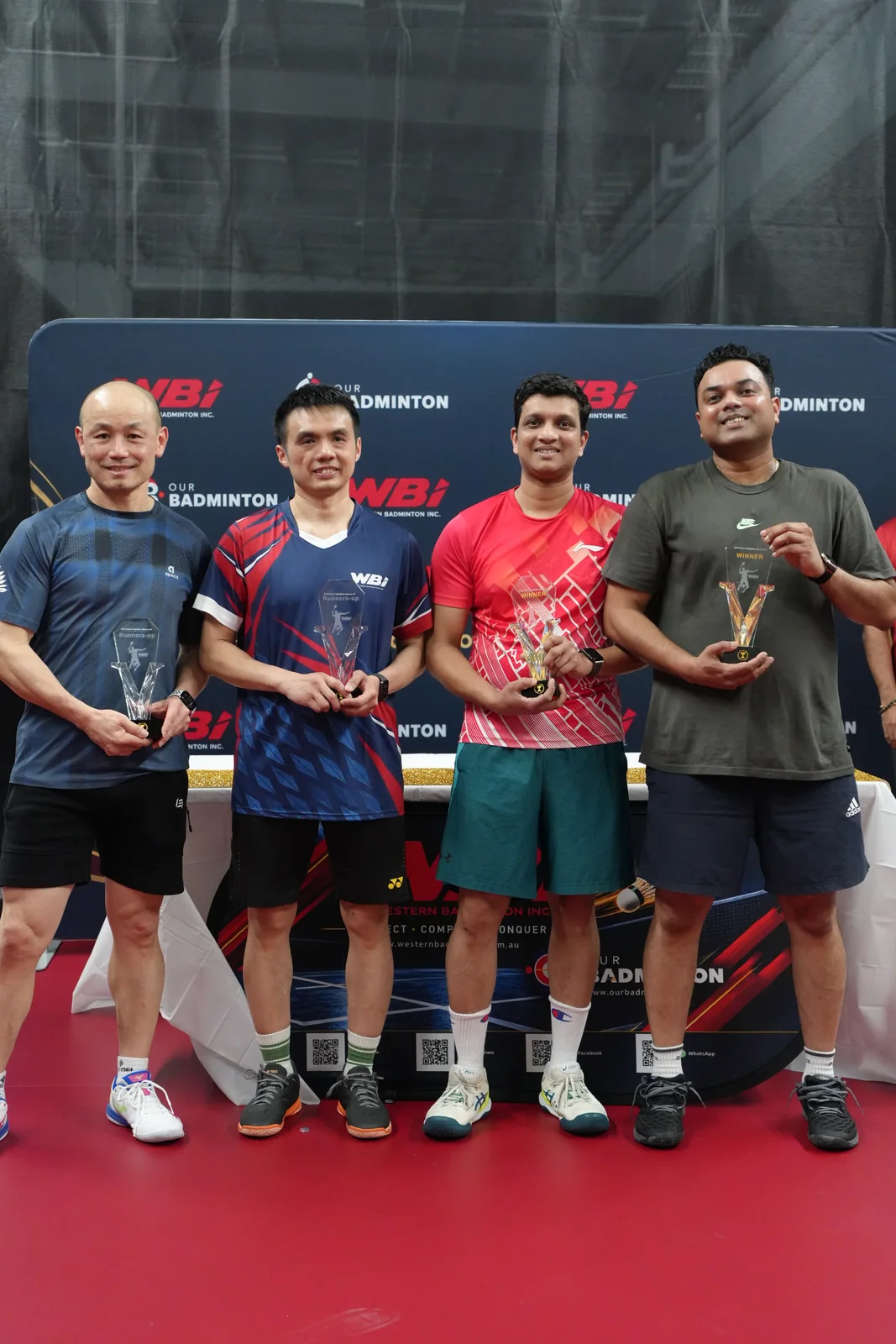 Men’s Doubles Above 40 winners and runners-up holding their trophies
